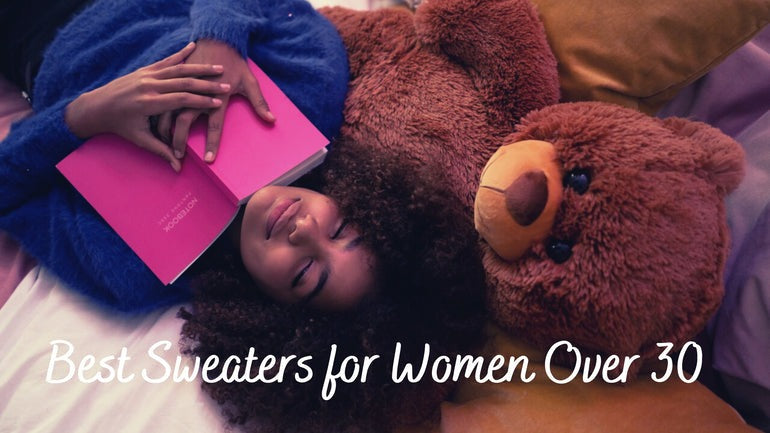 a girl holding a stuffed animal on a bed