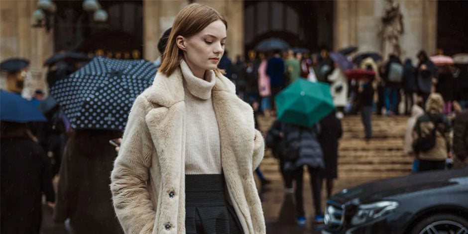 girl wearing biege fur jacket