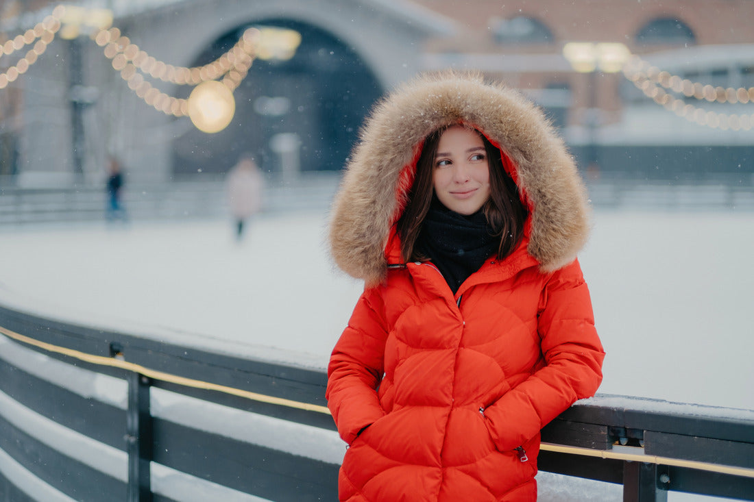 a woman in a red coat