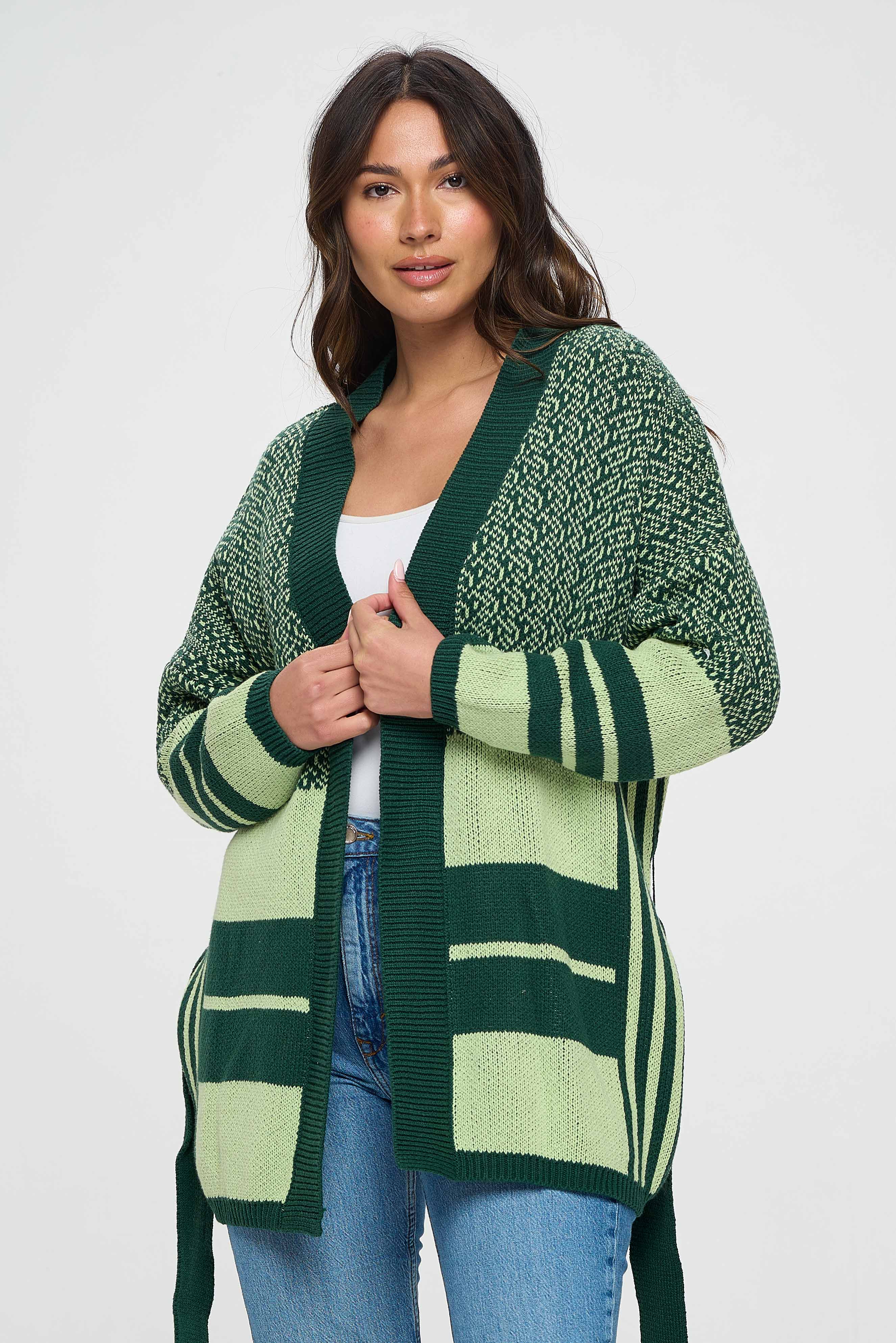 Stay cozy and stylish with this gorgeous knee-length sweater in shades of green. The stunning color gradient from light to dark adds depth and dimension to the sweater, while the knee-length design provides both warmth and coverage. 