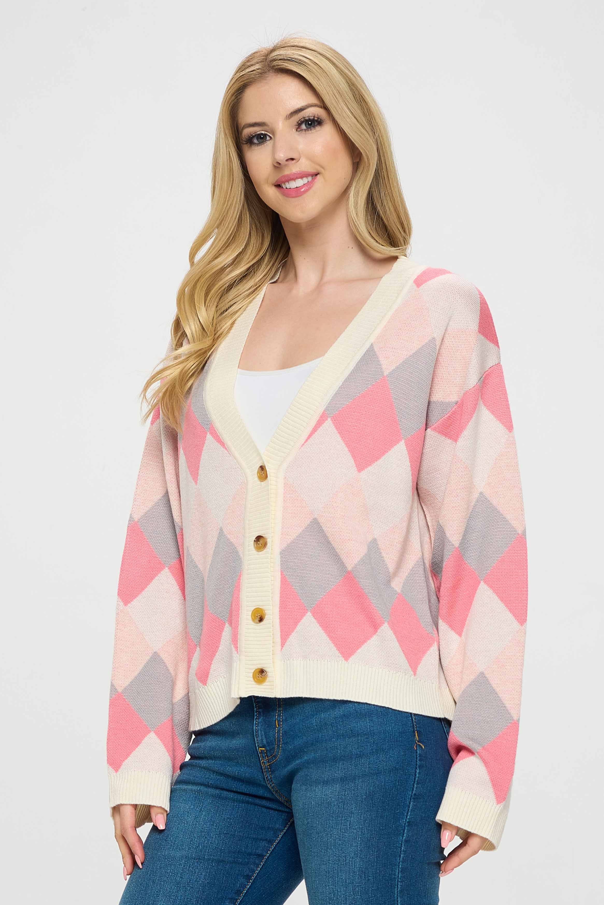 The long sleeves provide warmth and comfort, making it ideal for cooler weather. The diamond pattern adds a fun and playful element to the design, while the pink color gives it a soft and delicate look.