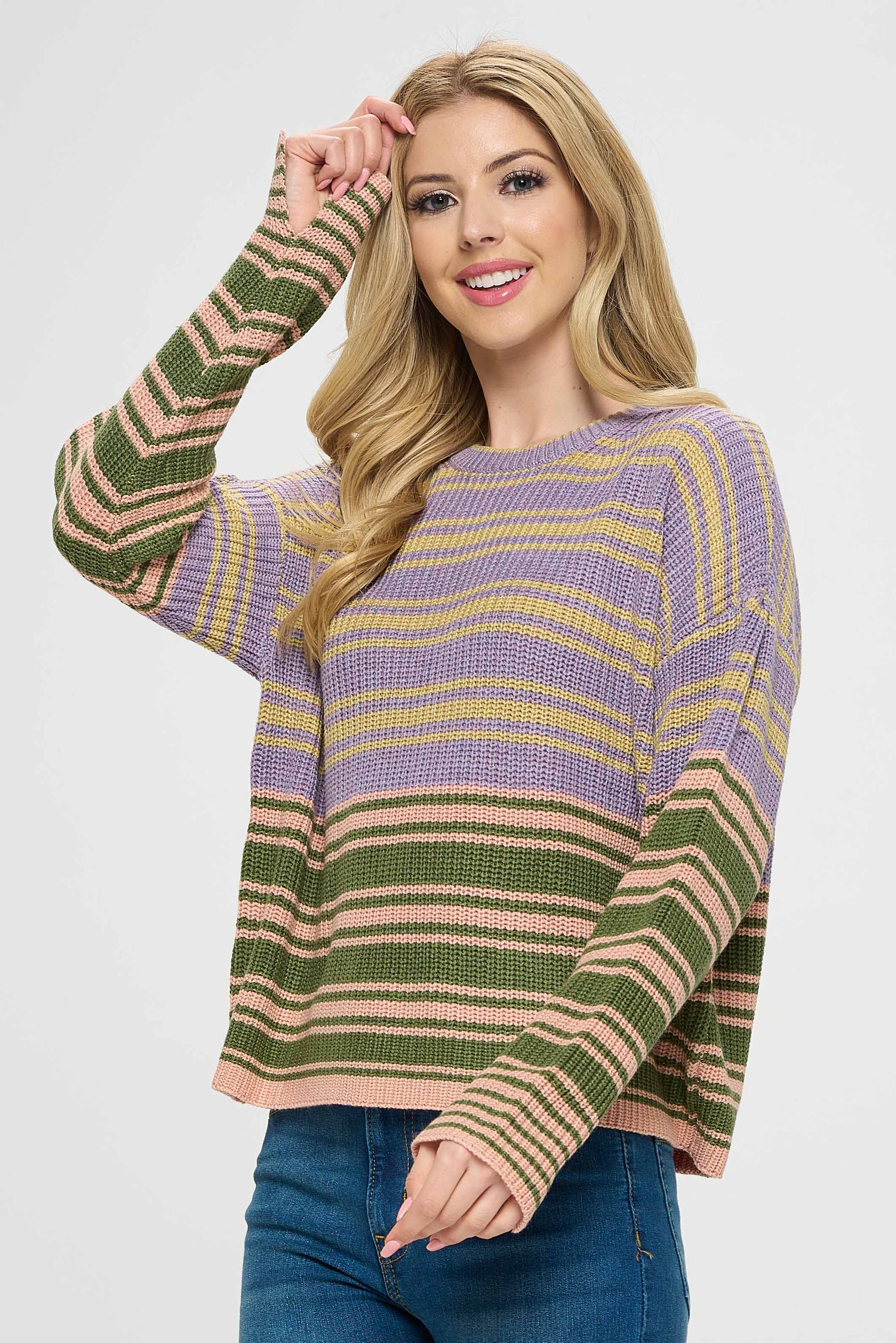 Additionally, a multicolored striped shirt can be worn underneath the sweater to add an extra layer of color and pattern. The shirt can feature a variety of different colored stripes, which can be paired with the lilac and green colors of the sweater for a cohesive and stylish look.