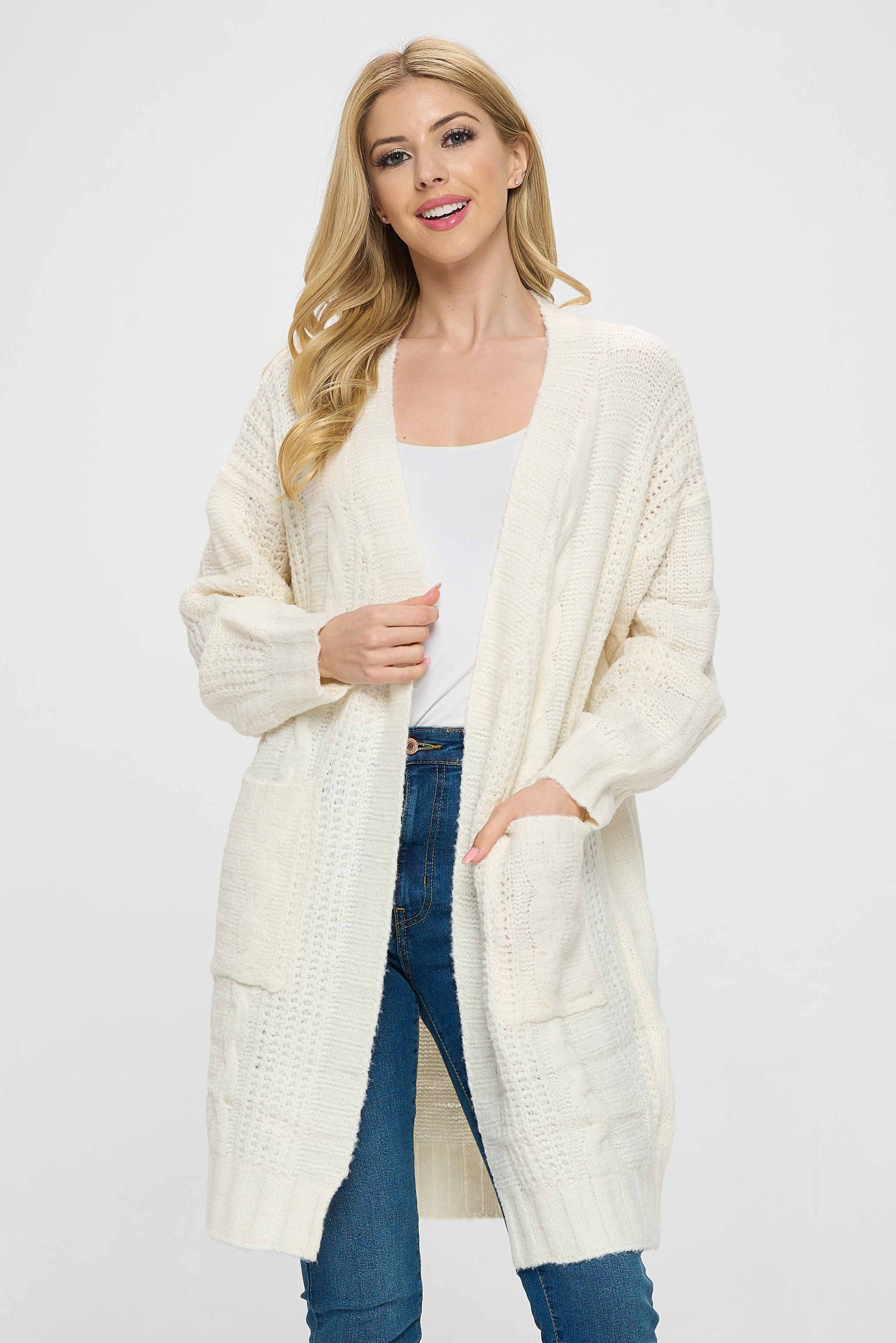 Our cabled sweater jacket is a perfect blend of style and comfort, designed to keep you warm and cozy in the colder weather. The sweater is beautifully crafted with cabled texture that creates a chic and modern look. The sweater features charming pockets that add an extra touch of elegance and practicality, making it a perfect choice for a casual outing or a cozy night in.